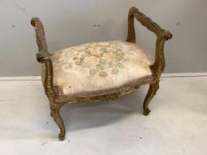 A 19th century French carved giltwood and composition dressing stool, width 62cm, depth 41cm, height