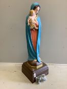 A large cast plaster Madonna and Child statue with a bag of fake marijuana. Provenance - used in Guy