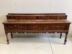 A mid 18th century oak low dresser, width 207cm, depth 46cm, height 97cm. Condition - fair