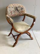 An early 20th century upholstered oak Savonarola style armchair, width 64cm, depth 53cm, height