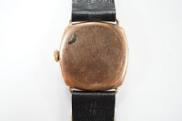 A gentleman's 1930's yellow metal manual wind wrist watch, with Arabic dial and subsidiary