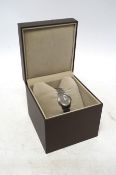 A lady's modern stainless Gucci quartz wrist watch, with date aperture, box and booklet. Condition -