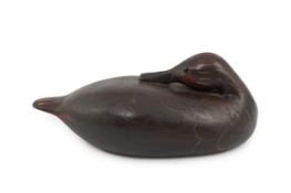 Manner of Guy Taplin (British, b.1939), a carved and painted oak model of a duck with glass inset