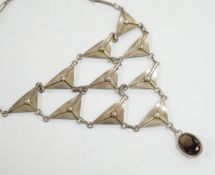 A stylish Polish white metal and single stone oval cut smoky quartz set drop choker necklace, makers