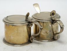 A pair of George V silver drum mustards, by Harman & Co, London 1929, 70mm, one with associated