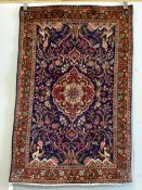 A Qom blue ground rug, 150 x 98cm. Condition - good