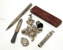 Small silver including a Victorian silver and mother of pearl fruit knife, a crucifix, a book