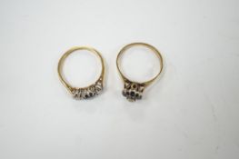 A modern 18ct gold, sapphire and diamond set three stone ring, size O, together with a similar 9ct