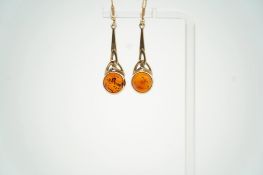 A modern suite of 9ct gold and amber set jewellery, comprising a necklace, 38cm, brooch and pair