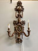 A pair of Louis XV style carved giltwood twin branch wall lights, height 110cm. Condition - fair