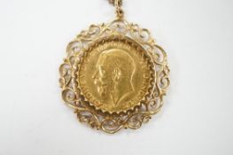 A George V gold sovereign, in a later 9ct gold pendant mount, on a 9ct chain, 63cm, gross weight
