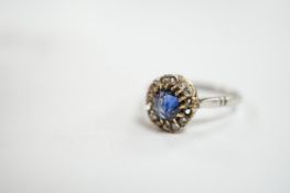 An early 20th century white metal (stamped plat), sapphire and diamond set cluster ring, size O,
