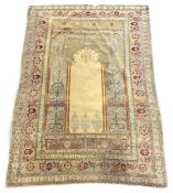 A Turkish silk prayer rug, with central mihrab and stylised floral borders, 205 x 122cm. Condition -