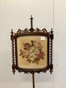 A pair of Victorian rosewood pole screens with floral tapestry banners, height 150cm. Condition -