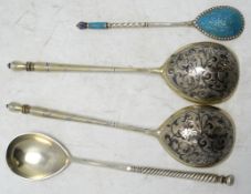 A pair of 19th century Russian 84 zolotnik and niello spoons, 15.5cm and two other Russian spoons