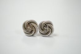 A pair of 750 and diamond chip set 'knot' ear studs with Boodles & Dunthorne butterflies, gross