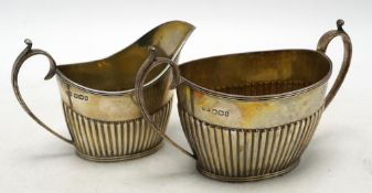 A late Victorian demi-fluted sugar bowl and cream jug, by Mappin & Webb, Sheffield, 1894, 8.6oz.