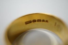 A 22ct gold wedding band, size P, 6.8 grams and a 9ct wedding band, 1.5 grams. Condition - fair