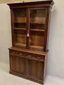 A late Victorian mahogany bookcase cabinet, width 122cm, depth 43cm, height 225cm. Condition - fair