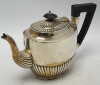 A late Victorian demi-fluted silver oval teapot, by Henry Bourne, Birmingham, 1896, gross weight