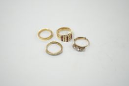 An 18ct and diamond chip set half hoop ring, size L/M, an 18ct gold band and two 9ct and gem set