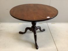 A George III circular mahogany tilt top tripod tea table, diameter 89cm, height 67cm. Condition -