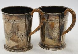 A pair of George V engraved silver mugs, with rattan handles, William Aitken, Birmingham, 1920,
