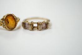 A 14k and single stone oval cut citrine set ring, size O, gross weight 2.8 grams and a modern 9ct