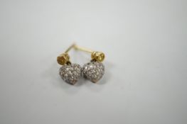 A modern pair of 750 and pave set diamond chip heart shaped ear studs, with single stone yellow