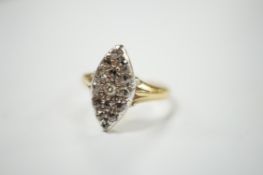 A yellow metal and diamond chip set marquise cluster ring, size K, gross weight 3 grams. Condition -