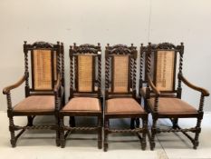 A set of eight late 19th century Carolean style carved oak caned back dining chairs, (six single,