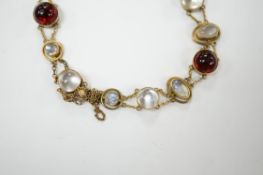 A George V 9ct, cabochon moonstone and cabochon red paste set bracelet, 16.5cm, gross weight 12