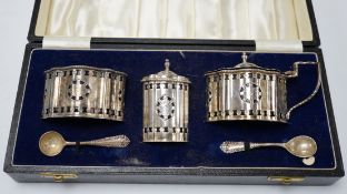 A cased 1970's silver three piece condiment set and two spoons by A. Chick & Sons, London, 1972,
