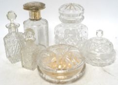 Six cut glass dressing table bottles and bowls, including a bottle with an 800 standard, large white