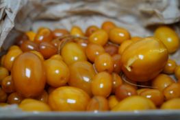 A quantity of assorted loose graduated amber beads, gross weight 146 grams. Condition poor to fair