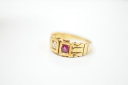 A late Victorian 18ct gold, ruby and diamond set three stone ring, size J, gross weight 4 grams.
