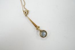 An Edwardian 15ct, aquamarine and seed pearl set drop pendant necklace, pendant 38mm, chain knotted,