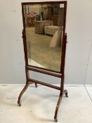 A Sheraton style mahogany cheval mirror, width 62cm, height 143cm. Condition - fair