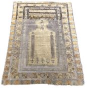 A Turkish silk prayer rug, with mihrab and stylised foliate borders on a gold ground, 185 x 137cm.