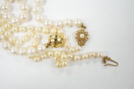 A single strand cultured pearl necklace, with 18k and multi gem set spherical clasp, 48cm, and one