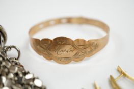 A 9ct gold bracelet inscribed ‘Merle’, a pair of 14k and diamond chip set earrings and an