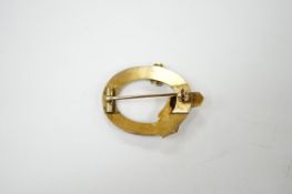 A late Victorian yellow metal, split pearl and enamel set open work buckle brooch, 34mm, gross