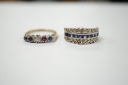 An engraved white metal sapphire ruby and diamond set swivelling triple band ring, size M/N,