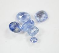 A group of ten cut unmounted pale blue sapphires, total carat weight approximately 15.1ct. Condition