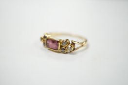 A yellow metal and single stone rectangular cut garnet? set ring, with six stone diamond set