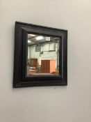 A 17th century Dutch ebonised ripple moulded wall mirror, width 50cm, height 53cm. Condition - fair