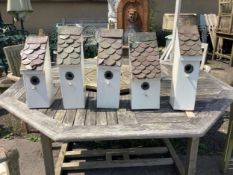 Five painted wood handmade birdboxes with shingle copper roofs, largest height 41cm. Condition -