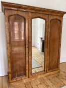 A Victorian walnut triple compactum wardrobe, width 201cm, depth 66cm, height 222cm. Condition -