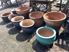 A pair of circular terracotta garden planters, diameter 49cm, height 41cm, together with seven other