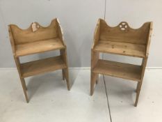A pair of small Gothic style pine two tier open bookcases, width 47cm, depth 26cm, height 76cm.